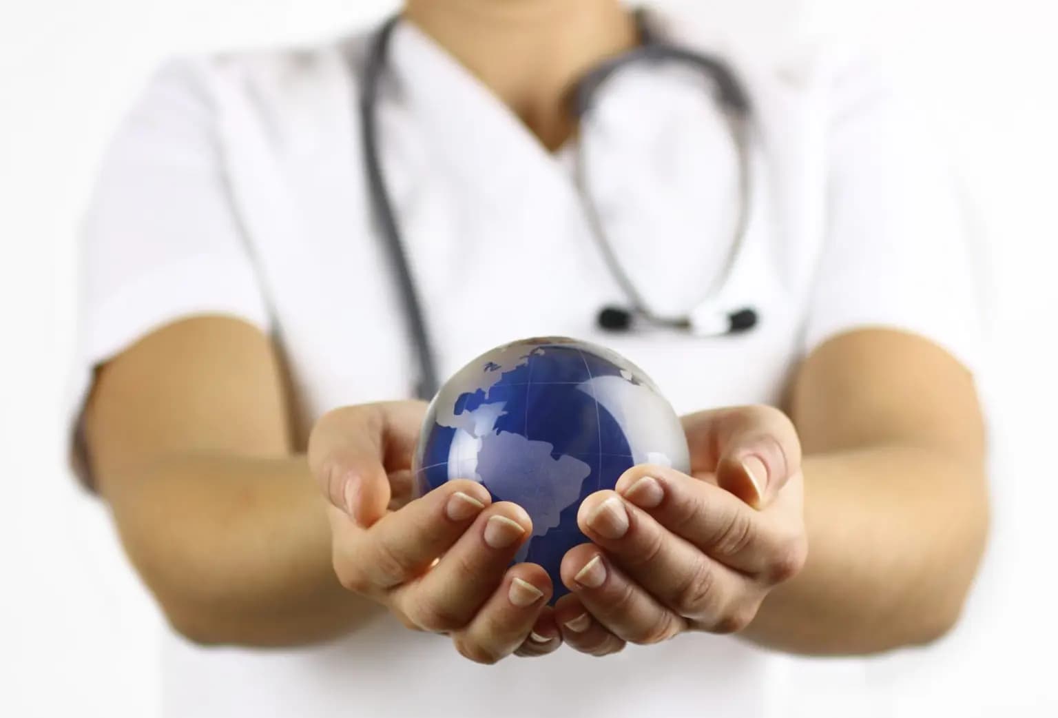 Doctor holding globe representing environmental impact